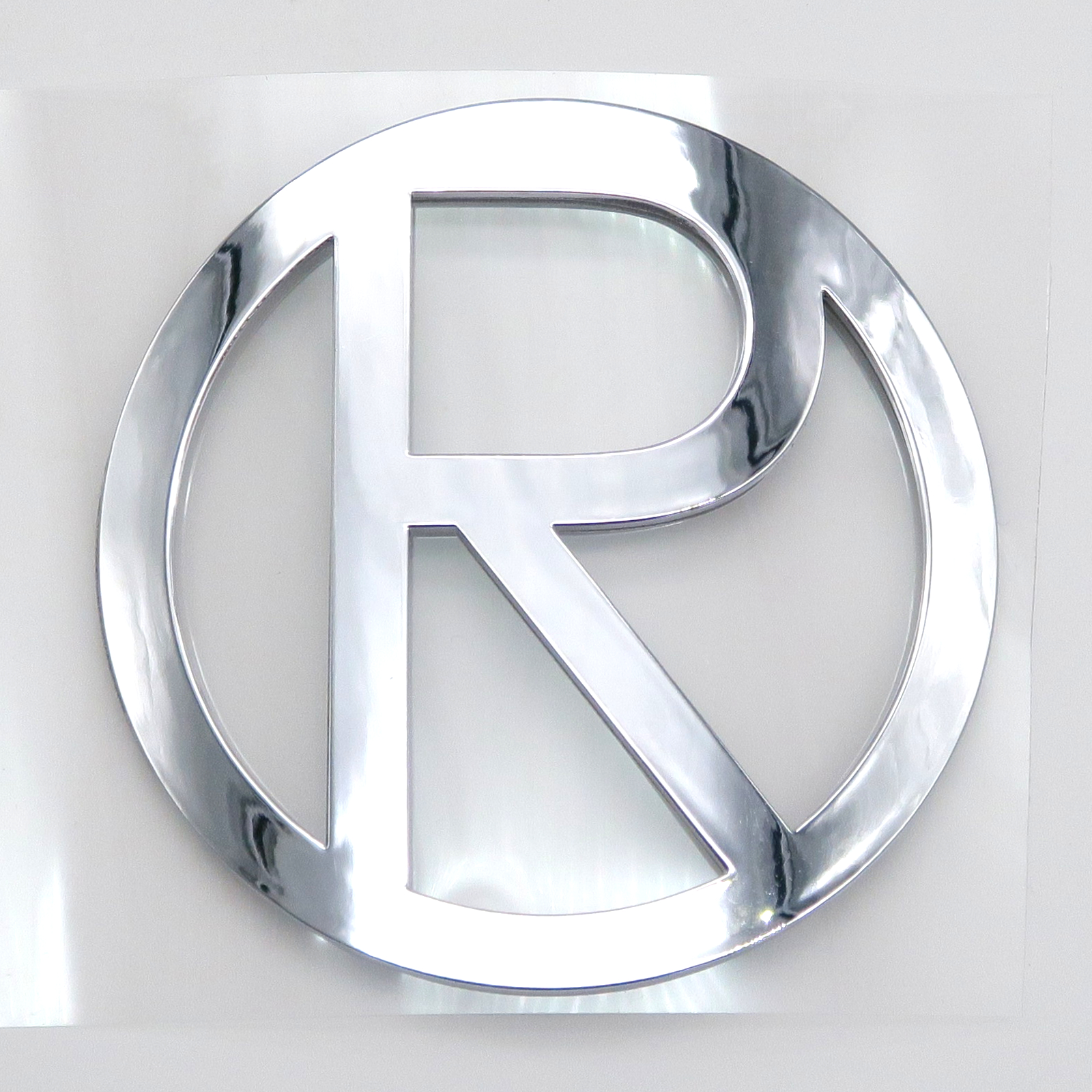 Trike15/25V2Pm/V3Pm/Quad15/25V2Pm/V3Pm/R31 - Aufkleber, Rolektro Logo, R, rund, 80mm, Metalloptik, vorne