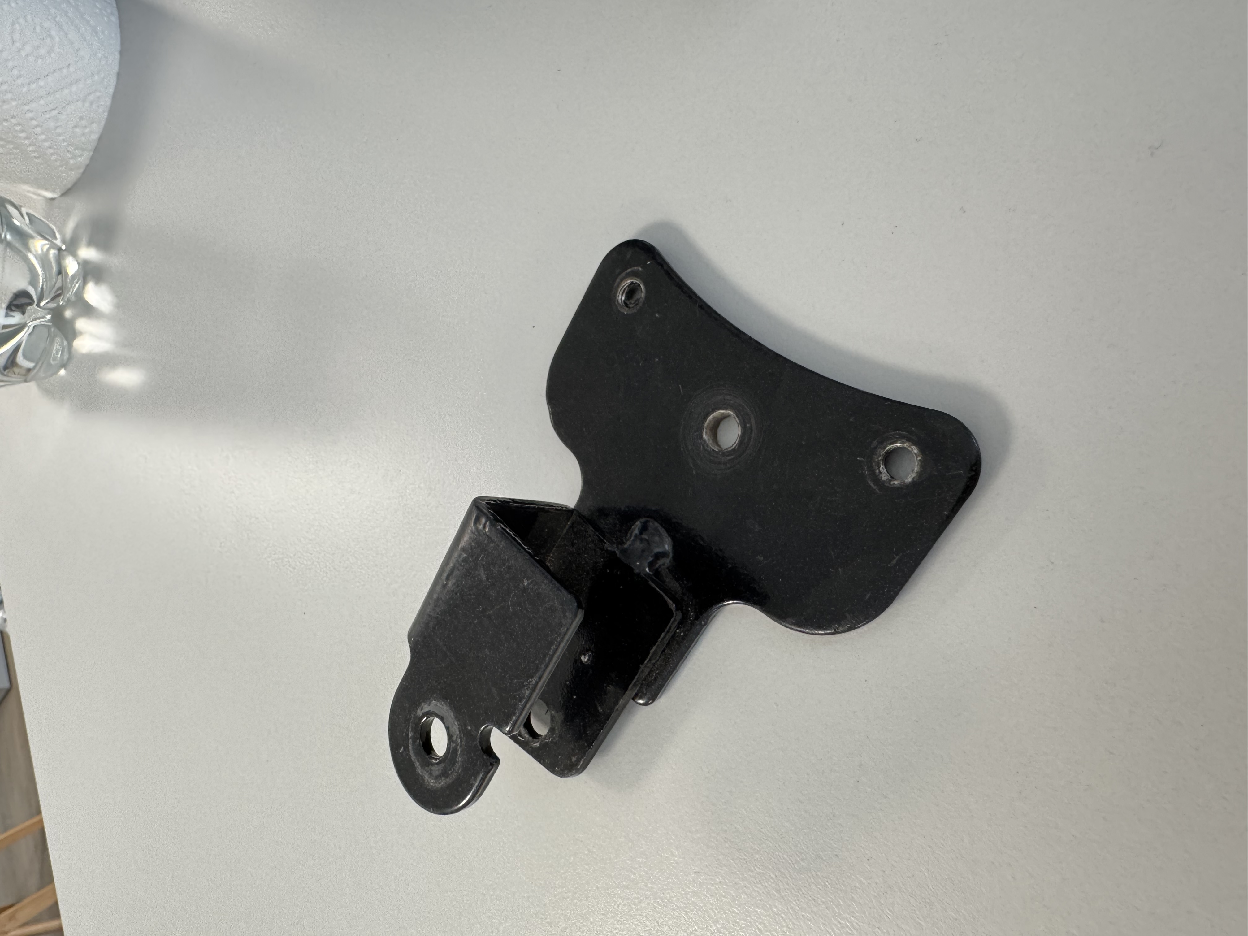 Carrier25V2/V3 - Halter für Fußraste, links